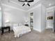 Bedroom with ceiling fan, a doorway to a bathroom and a doorway to a closet at 4845 Josie Way, Acworth, GA 30101