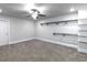Spacious carpeted bedroom featuring neutral walls, a fan, and walk-in closet at 4845 Josie Way, Acworth, GA 30101