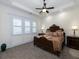 Spacious bedroom features a ceiling fan, and two bedside tables with lamps at 4845 Josie Way, Acworth, GA 30101