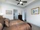Bedroom featuring a ceiling fan, two artworks hanging on the wall, and two doorways at 4845 Josie Way, Acworth, GA 30101