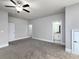 Spacious carpeted bedroom with neutral walls, fan and access to ensuite bathroom at 4845 Josie Way, Acworth, GA 30101
