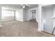 Large bonus room featuring neutral carpet, ample natural light, and ceiling fan at 4845 Josie Way, Acworth, GA 30101