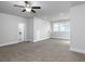 Large carpeted bonus room featuring neutral walls, a fan, and access to bathroom at 4845 Josie Way, Acworth, GA 30101