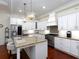 Bright kitchen with stainless steel appliances, granite counters, and an island with bar seating, ready for entertaining at 4845 Josie Way, Acworth, GA 30101