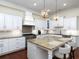 Beautiful kitchen with granite countertops, stainless steel appliances, and a central island with seating at 4845 Josie Way, Acworth, GA 30101
