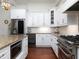 Bright kitchen features white cabinets, granite countertops, stainless steel appliances, and a wine fridge at 4845 Josie Way, Acworth, GA 30101