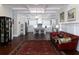 Open-concept design connects the living room with hardwood floors and coffered ceiling to a spacious kitchen at 4845 Josie Way, Acworth, GA 30101