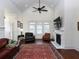 Vaulted ceiling, fireplace, and hardwood floors highlight this well-lit living room with a ceiling fan at 4845 Josie Way, Acworth, GA 30101
