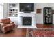 Cozy living room showcases a fireplace, built-in shelving, and a comfortable seating arrangement at 4845 Josie Way, Acworth, GA 30101