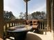Enjoy outdoor living on this covered patio with cozy seating and a charming fire pit table at 4845 Josie Way, Acworth, GA 30101