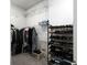 Bright walk-in closet with metal shelving and hanging racks providing ample storage space at 4845 Josie Way, Acworth, GA 30101