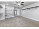 Large walk-in closet features neutral walls, carpet, and custom adjustable storage at 4845 Josie Way, Acworth, GA 30101
