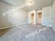 Bedroom with entry to bathroom at 1367 Fern Ridge Ct # 31, Norcross, GA 30093