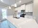 Bright kitchen features white cabinets, granite countertops, and a stainless steel faucet at 1367 Fern Ridge Ct # 31, Norcross, GA 30093