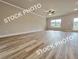 Spacious living room with wood flooring, ceiling fan, and plenty of natural light at 1367 Fern Ridge Ct # 31, Norcross, GA 30093