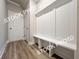 The mudroom features a built-in bench and coat rack, great for organization at 1367 Fern Ridge Ct # 31, Norcross, GA 30093