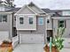 Charming townhome showcasing a modern design with painted brick and gray siding at 1377 Fern Ridge Ct # 32, Norcross, GA 30093