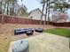 Inviting back patio with stylish outdoor seating, a privacy fence, and decorative string lights at 2168 Berryhill Se Cir, Smyrna, GA 30082