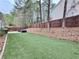 Spacious backyard with artificial turf and a privacy fence providing a great outdoor space at 2168 Berryhill Se Cir, Smyrna, GA 30082