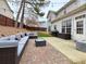 Charming backyard patio features outdoor furniture and string lights that create a cozy outdoor space at 2168 Berryhill Se Cir, Smyrna, GA 30082