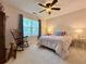 Cozy bedroom featuring a ceiling fan, plush carpeting, and a comfortable bed with charming decor at 2168 Berryhill Se Cir, Smyrna, GA 30082