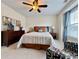 Inviting bedroom featuring a ceiling fan, comfortable seating, and natural light from the window at 2168 Berryhill Se Cir, Smyrna, GA 30082