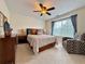 Bright bedroom with a ceiling fan, comfortable seating, neutral carpet and a window with natural light at 2168 Berryhill Se Cir, Smyrna, GA 30082