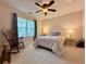 Comfortable bedroom featuring a ceiling fan, plush carpeting, and a charming bed with lovely decor at 2168 Berryhill Se Cir, Smyrna, GA 30082