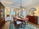 Open-concept dining area connected to the living room, features a stylish table and modern decor at 2168 Berryhill Se Cir, Smyrna, GA 30082