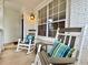 Comfortable rocking chairs and pillows adorn the charming front porch of this lovely home at 2168 Berryhill Se Cir, Smyrna, GA 30082
