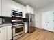 Well-equipped kitchen featuring stainless steel appliances and ample white cabinets for storage at 2168 Berryhill Se Cir, Smyrna, GA 30082