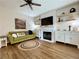 Comfortable living room featuring a fireplace, built-in cabinets, and stylish decor at 2168 Berryhill Se Cir, Smyrna, GA 30082