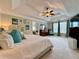 Spacious main bedroom suite featuring a tray ceiling, fan, sitting area, and neutral decor at 2168 Berryhill Se Cir, Smyrna, GA 30082
