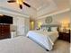Bright main bedroom with a decorative tray ceiling, neutral paint, and plush carpet flooring at 2168 Berryhill Se Cir, Smyrna, GA 30082