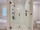Elegant glass shower enclosure with a rainfall showerhead and decorative tile surround at 2168 Berryhill Se Cir, Smyrna, GA 30082
