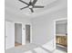 Bright bedroom featuring ceiling fan, with doorways to bathroom and closet at 2637 Camphor Se Xing # 83, Smyrna, GA 30080