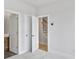Clean bedroom design showcasing open doorway with view of staircase and bath access at 2637 Camphor Se Xing # 83, Smyrna, GA 30080