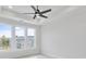 An airy bedroom features a ceiling fan and three large sunny windows at 2637 Camphor Se Xing # 83, Smyrna, GA 30080