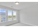 Well-lit bedroom features three windows and neutral carpeting, providing a cozy and comfortable space at 2637 Camphor Se Xing # 83, Smyrna, GA 30080