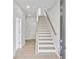 Bright entryway featuring hardwood floors and a staircase with modern wood and white accents at 2637 Camphor Se Xing # 83, Smyrna, GA 30080