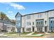 Attractive townhomes with a modern design, lush lawns, and inviting walkways on a sunny day at 2637 Camphor Se Xing # 83, Smyrna, GA 30080