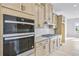 Modern kitchen features built-in stainless steel ovens, sleek countertops, and light wood cabinetry at 2637 Camphor Se Xing # 83, Smyrna, GA 30080