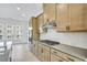 Bright kitchen features stainless steel appliances, herringbone backsplash and light wood cabinets at 2637 Camphor Se Xing # 83, Smyrna, GA 30080