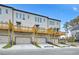 Rear exterior view of townhomes with garages and individual decks at 2637 Camphor Se Xing # 83, Smyrna, GA 30080