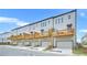 Rear exterior of townhomes, showcasing decks and garage entrances at 2637 Camphor Se Xing # 83, Smyrna, GA 30080