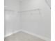 Walk-in closet with white wire shelving and neutral carpet flooring at 2637 Camphor Se Xing # 83, Smyrna, GA 30080