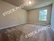 Neutral bedroom with carpet, a window, and ample space at 1397 Fern Ridge Ct # 34, Norcross, GA 30093