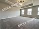 A Primary bedroom with a ceiling fan, recessed lighting, and large windows at 1397 Fern Ridge Ct # 34, Norcross, GA 30093