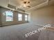A Primary bedroom with a ceiling fan, recessed lighting, and large windows at 1397 Fern Ridge Ct # 34, Norcross, GA 30093