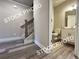 Bright entryway with staircase, hardwood floors, and a view of the half bathroom at 1397 Fern Ridge Ct # 34, Norcross, GA 30093